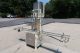MRM 6 Spout Semi-Automatic Pressure Gravity Filler, with Motorized Conveyor