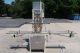 MRM 6 Spout Semi-Automatic Pressure Gravity Filler, with Motorized Conveyor