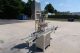MRM 6 Spout Semi-Automatic Pressure Gravity Filler, with Motorized Conveyor