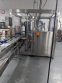 Apacks Six Head Automatic Mass Flow Meter Pressure Filling Machine, with conveyor