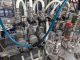 Apacks Six Head Automatic Mass Flow Meter Pressure Filling Machine, with conveyor